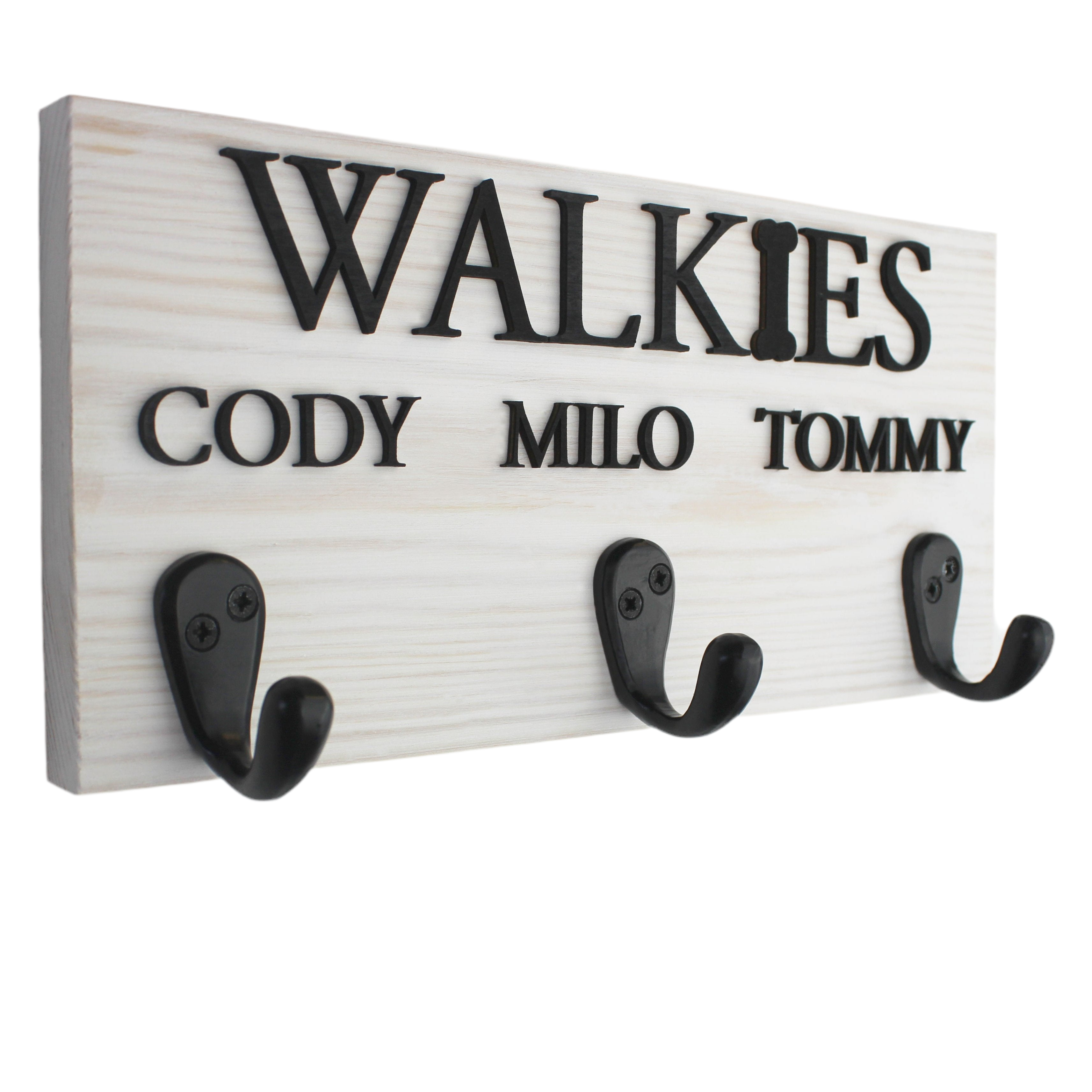 This elegant personalised dog lead hook in a crisp white finish features raised black lettering, making it perfect for showcasing up to three pet names. With three sturdy hooks, it's large enough to organize leads, collars, and accessories for multiple pets. Handcrafted from premium wood, this stylish and functional piece adds a sleek, modern touch to any home while keeping your pet’s gear neatly stored.