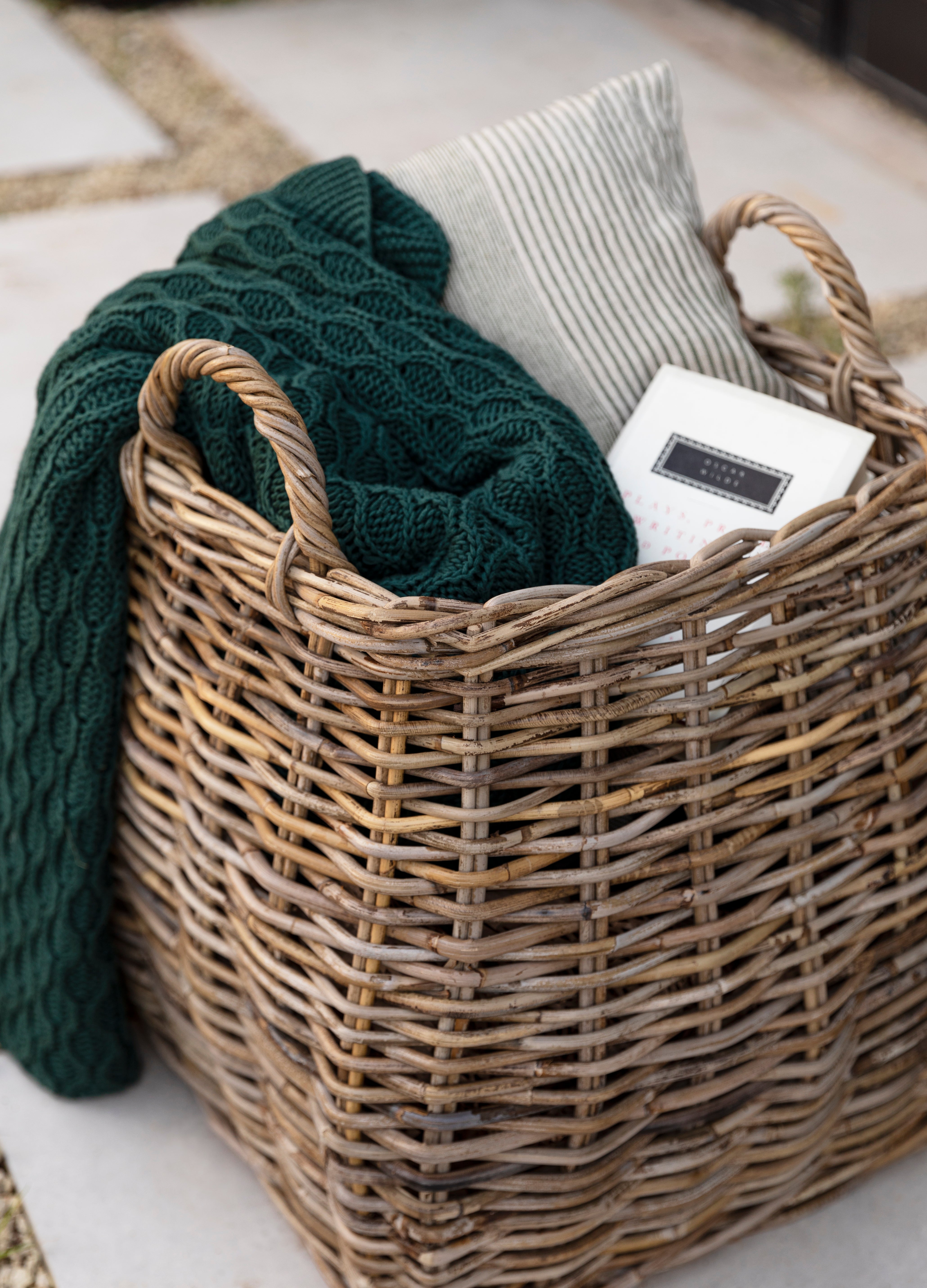 This large rattan basket is perfect for storing throws, books, cushions, and more. Its generous size and sturdy construction make it ideal for keeping your living room or bedroom tidy. With its rustic charm and versatile design, it can hold it all while adding a stylish touch to any space.