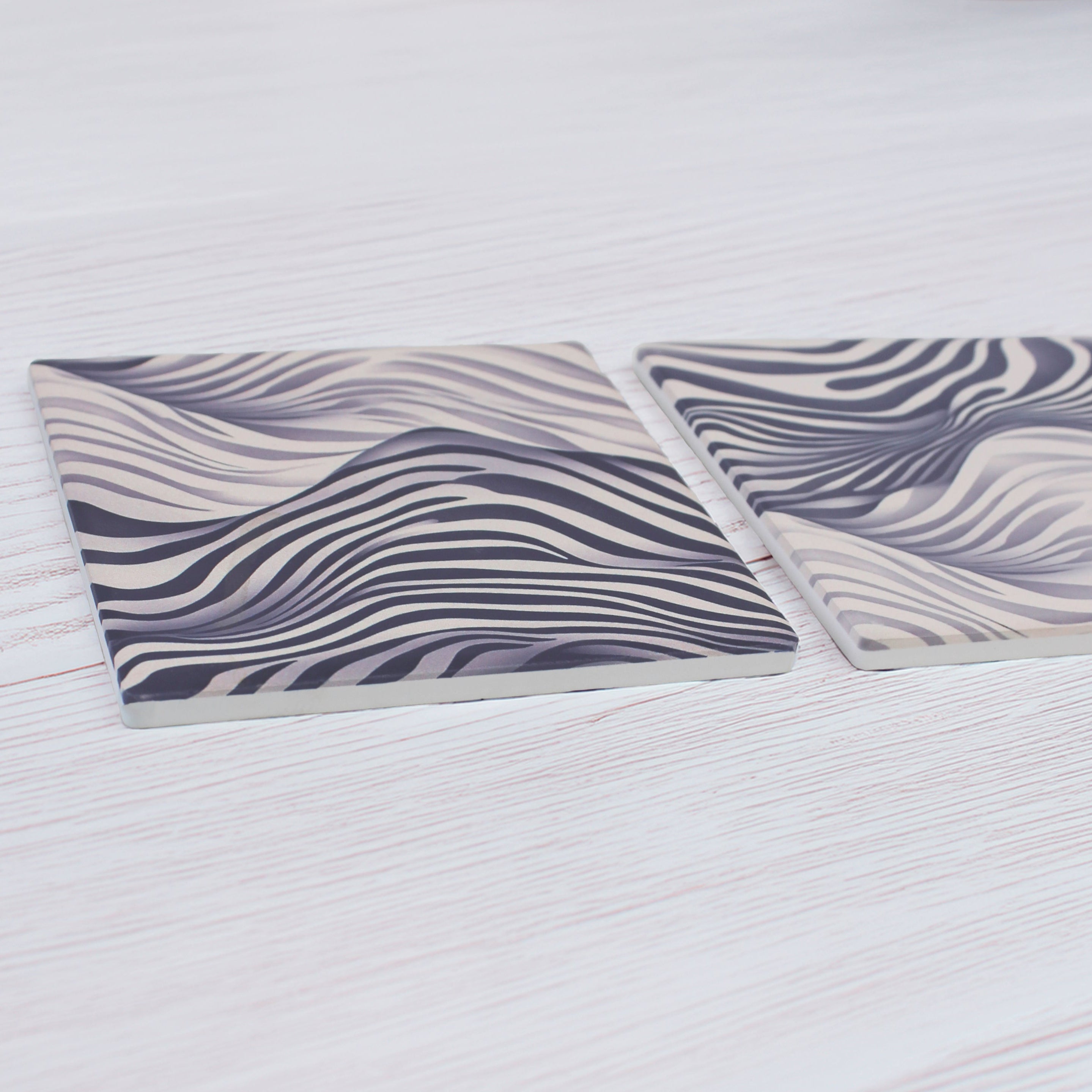 Add a bold touch to any space with our Funky Zebra Pattern Ceramic Coaster Set, featuring a striking zebra-inspired design with a modern twist, this set of 4 brings personality and style to your table.
This elegant coaster set features two distinct yet beautifully coordinated designs, perfect for adding style and sophistication to your table setting.
Available in matte or gloss finish to suit your style.
Each coaster is finished with a crisp white, cork-backed base for both beauty and practicality.