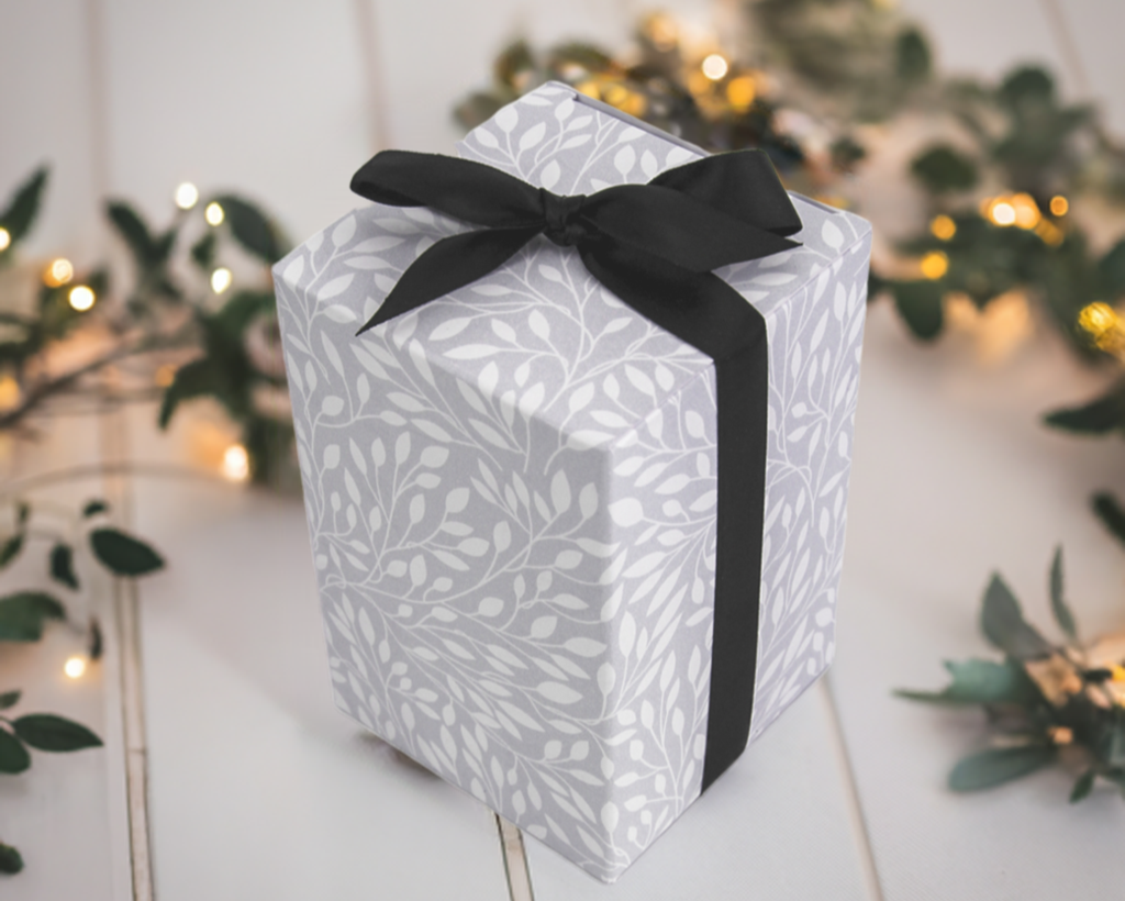 "These fragrance-free candles in a blue glass holder make stunning gifts, offering a thoughtful and eco-friendly way to brighten someone's space." we offer a gift wrapping service