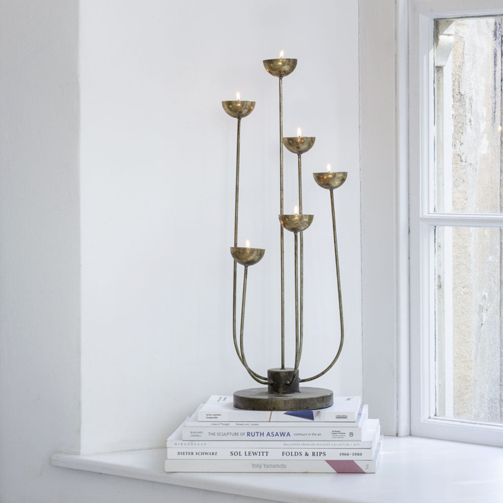 "Vintage-style matte gold candle centrepiece, exuding timeless charm with a soft, muted gold finish, perfect for enhancing any space."