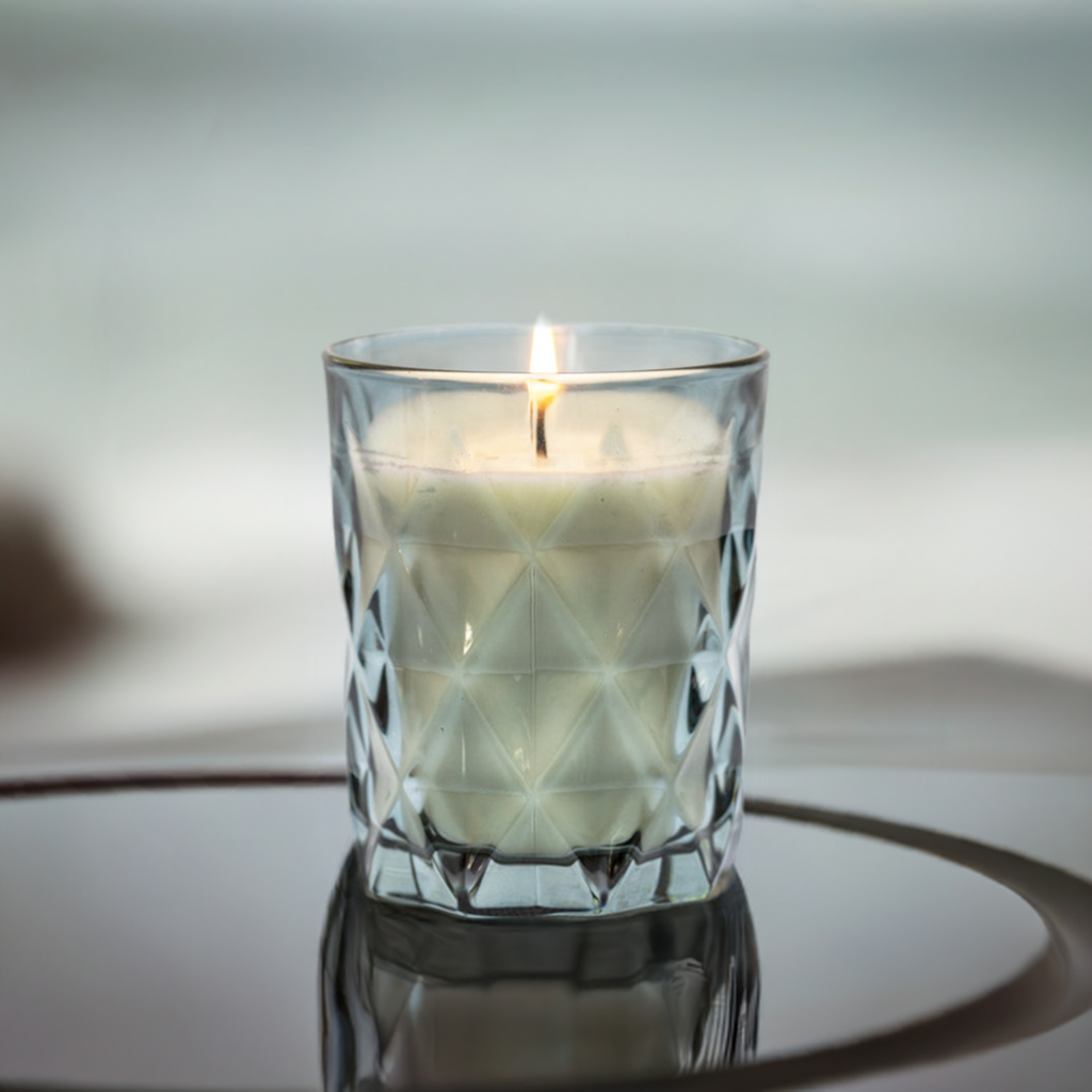 "Beautiful blue glass candle providing a gentle, flickering light, ideal for those who love a subtle glow without fragrance."
