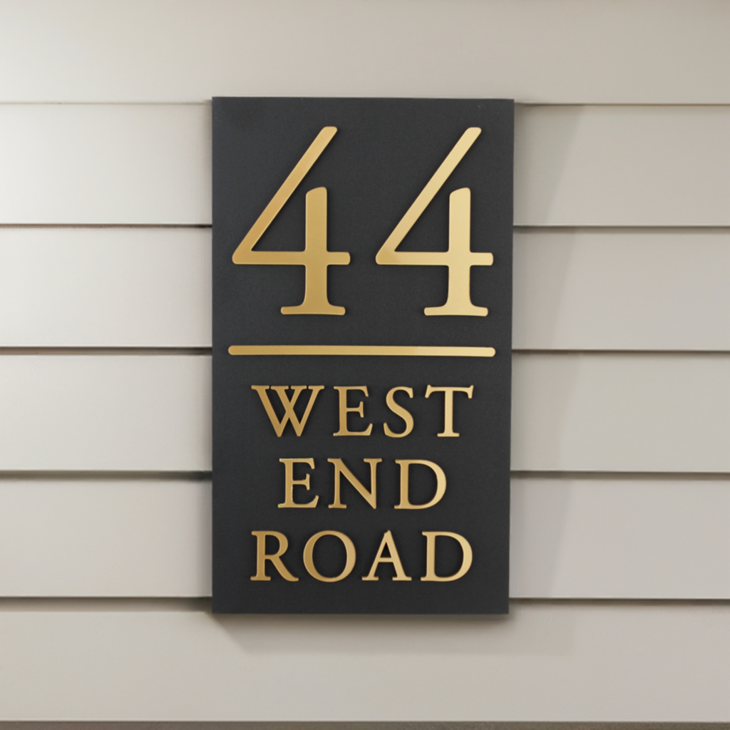 This stylish 25 x 15 cm outdoor house sign is perfect for narrower spaces, adding a sophisticated touch to your home while ensuring your house name or number is clear and easy to read, so you never miss a delivery.
With a durable matte black finish, this sign is designed for outdoor use and features a sleek parallel line for a clean, modern look. The raised lettering, available in gold, silver, or wood effect, creates a striking three-dimensional finish that enhances visibility and curb appeal.