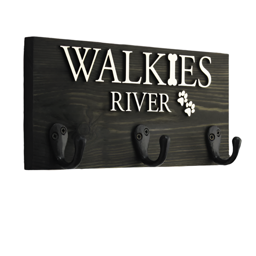 This sleek personalised dog lead hook in a rich ebony finish adds sophistication and style to your home. Handcrafted from premium wood, it features raised lettering in natural wood or black, allowing you to personalise it with your pet’s name and a paw print. A perfect way to keep your pet’s leads, collars, and accessories organised while complementing your home décor.