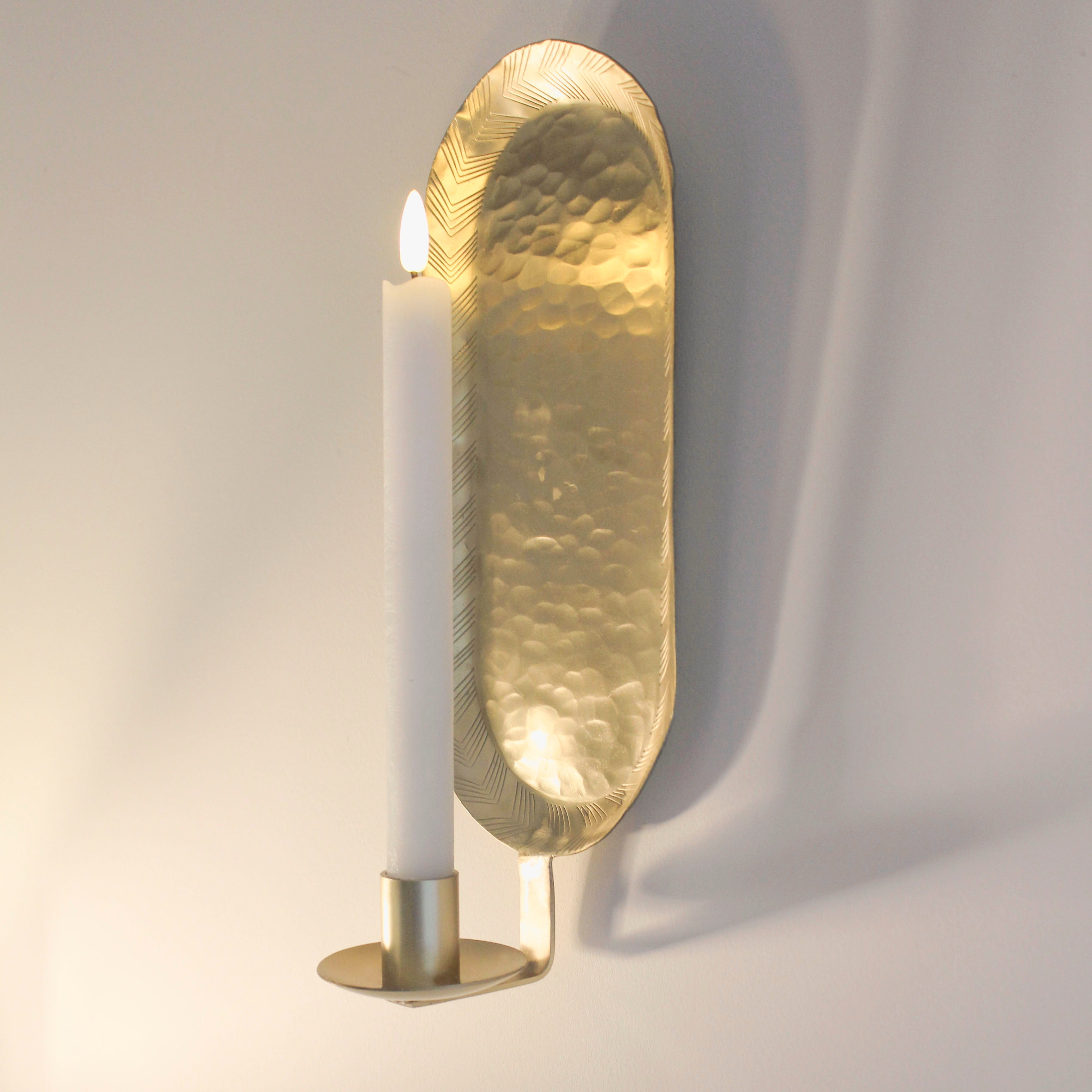 "Beautiful wall candle holder with etched brass detail, perfect for adding charm and sophistication to any room."