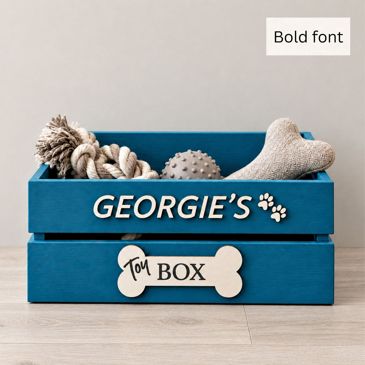 Blue personalised wooden dog toy box with Georgie’s name in bold lettering