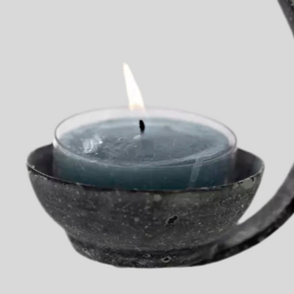 "Zoomed-in view of a charming tea light holder with a vintage antique finish, designed to hold a tea light candle and create a soft, inviting glow."