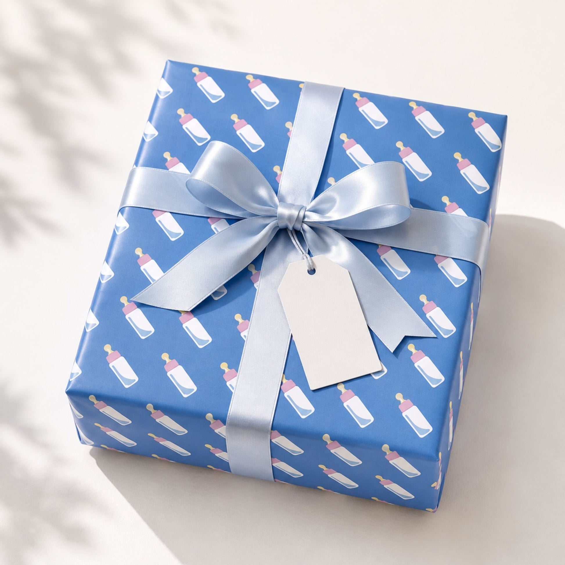Pink and blue baby gift wrapping paper styled with teddy bear