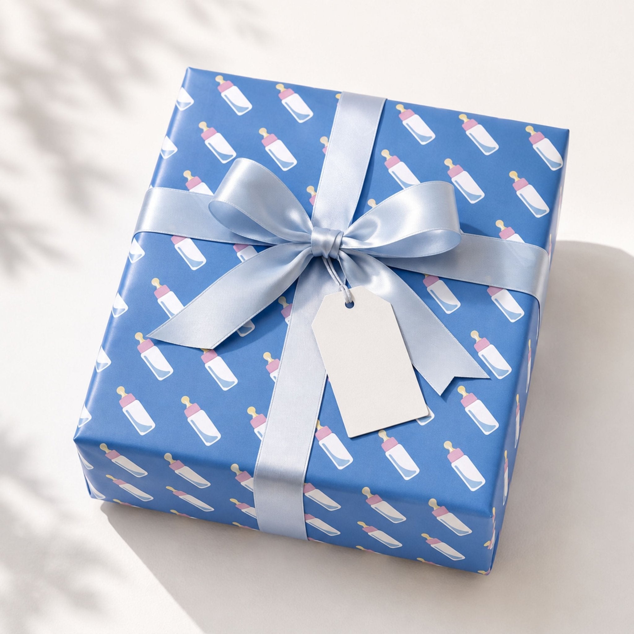 Pink and blue baby gift wrapping paper styled with teddy bear