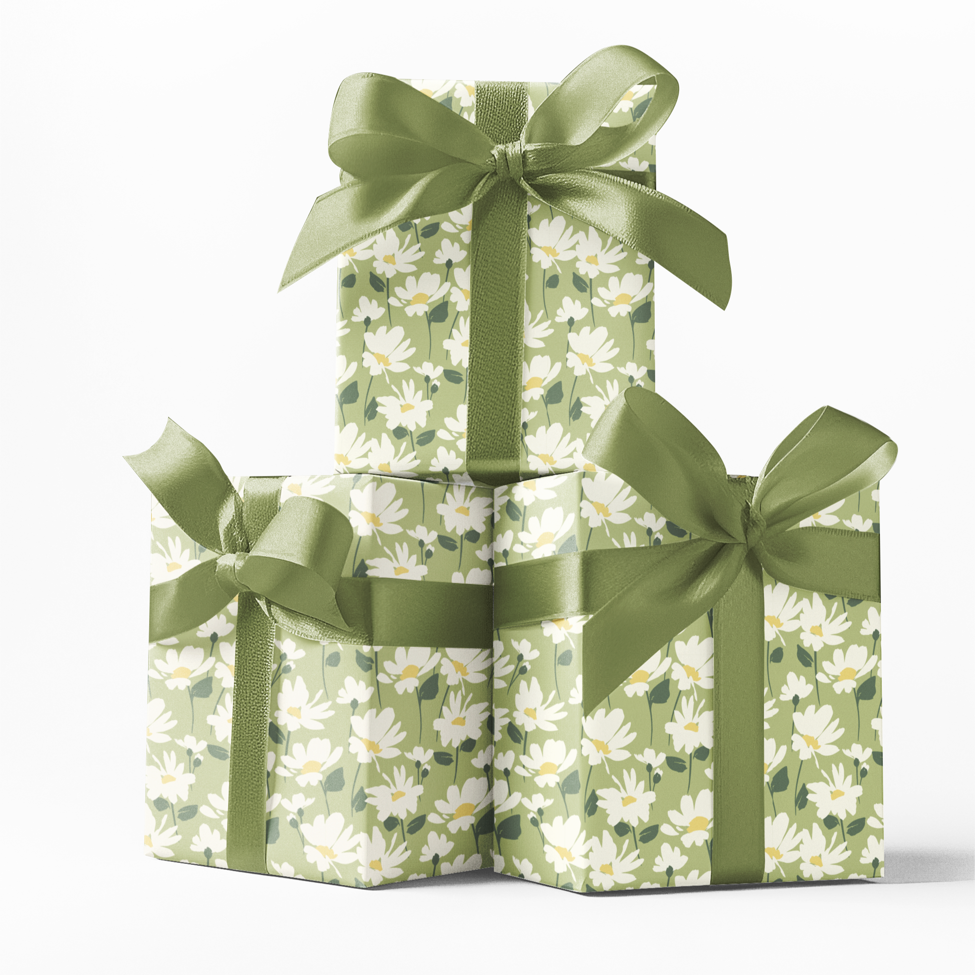 Three stacked gift boxes with floral patterns and green ribbons on a white background