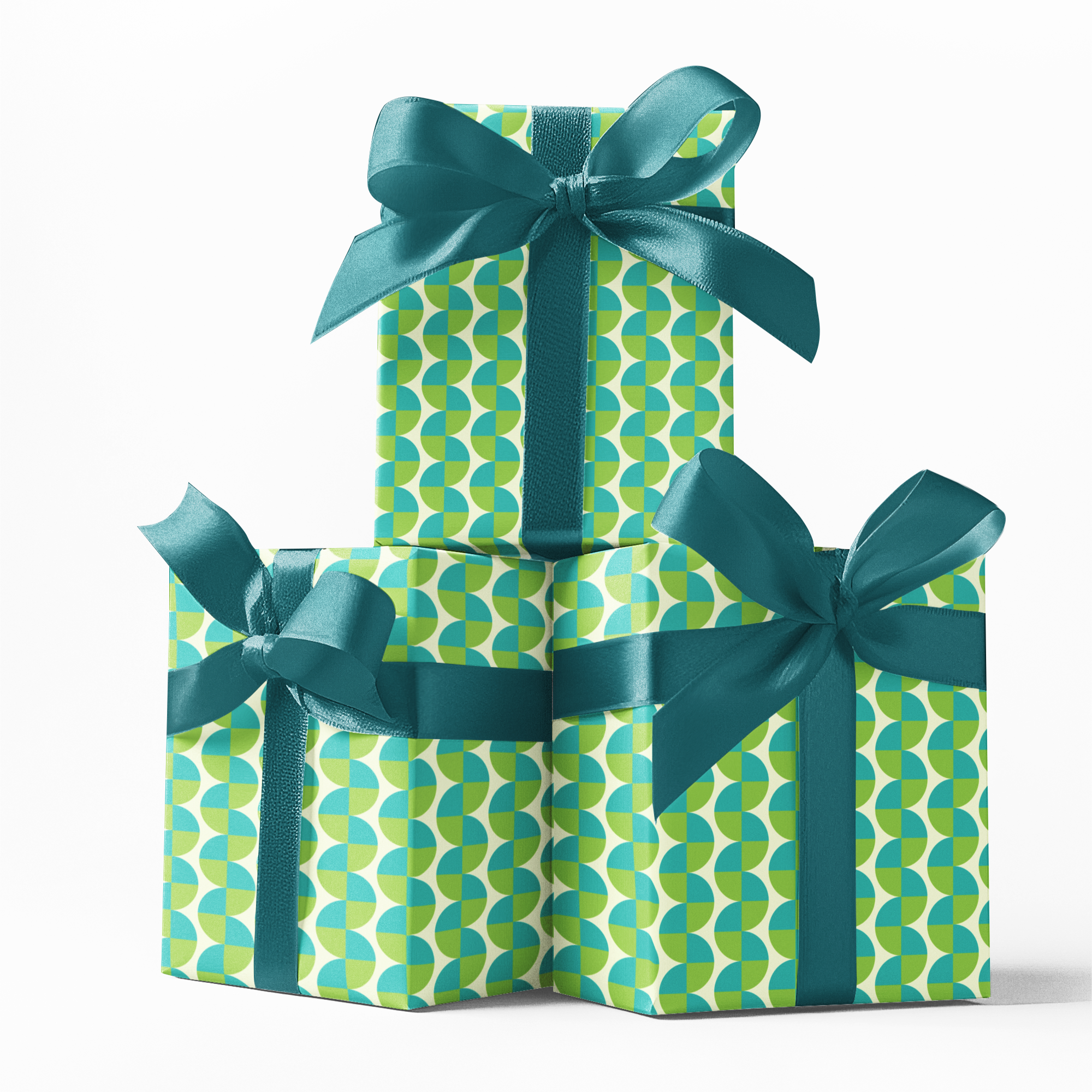 Three gift boxes with green and blue patterned wrapping paper and ribbons on a white background