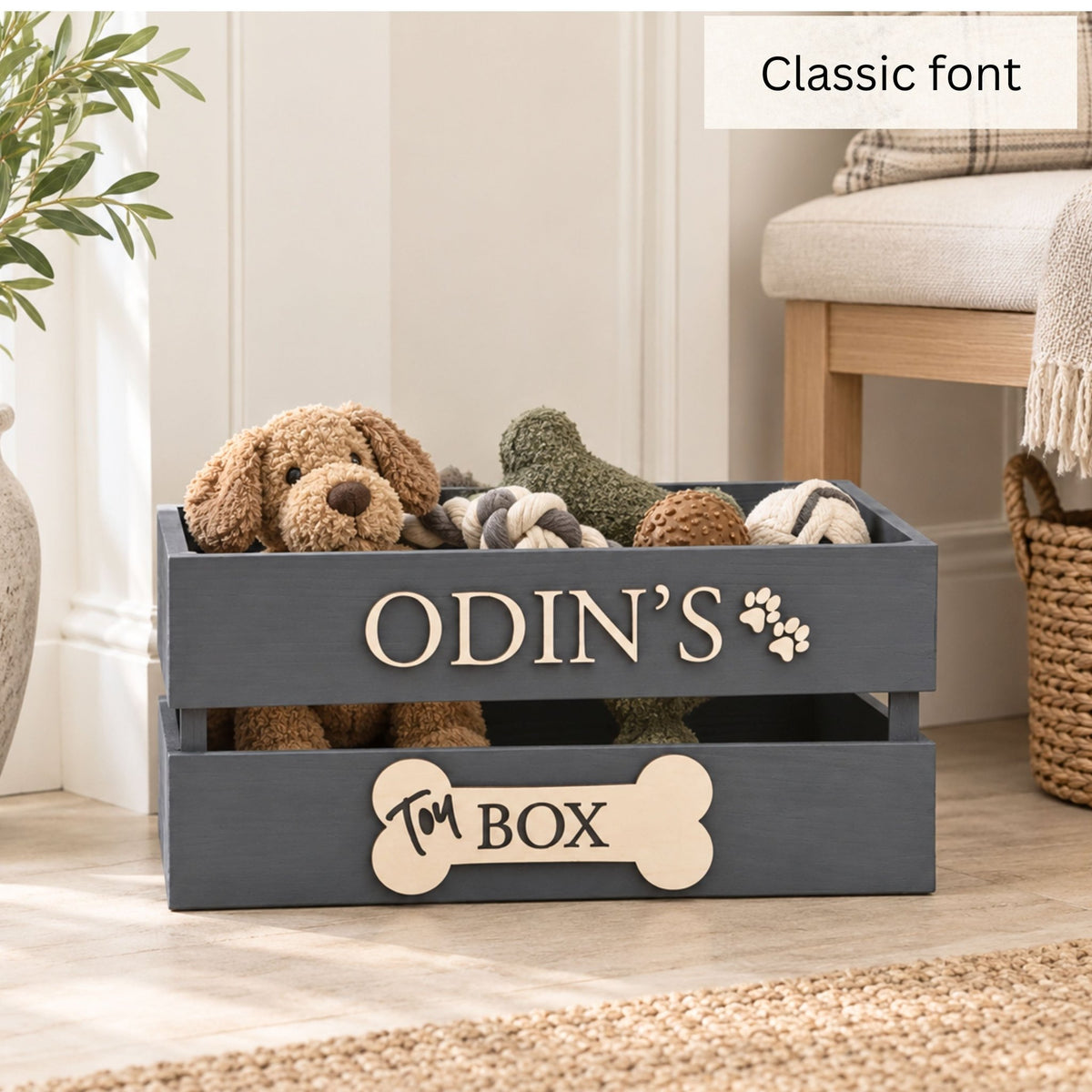 Dark grey personalised wooden dog toy box with Odin’s name in raised lettering