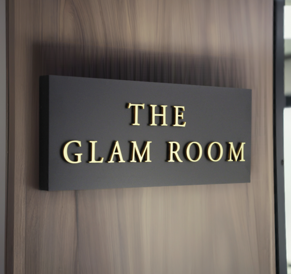 Classic 30 x 12 cm black house sign with raised gold lettering 2 lines of wording for a clear and stylish display.