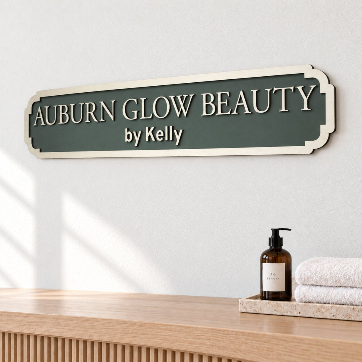 Green personalised “Auburn Glow Beauty by Kelly” salon sign with raised wooden lettering and a decorative border.