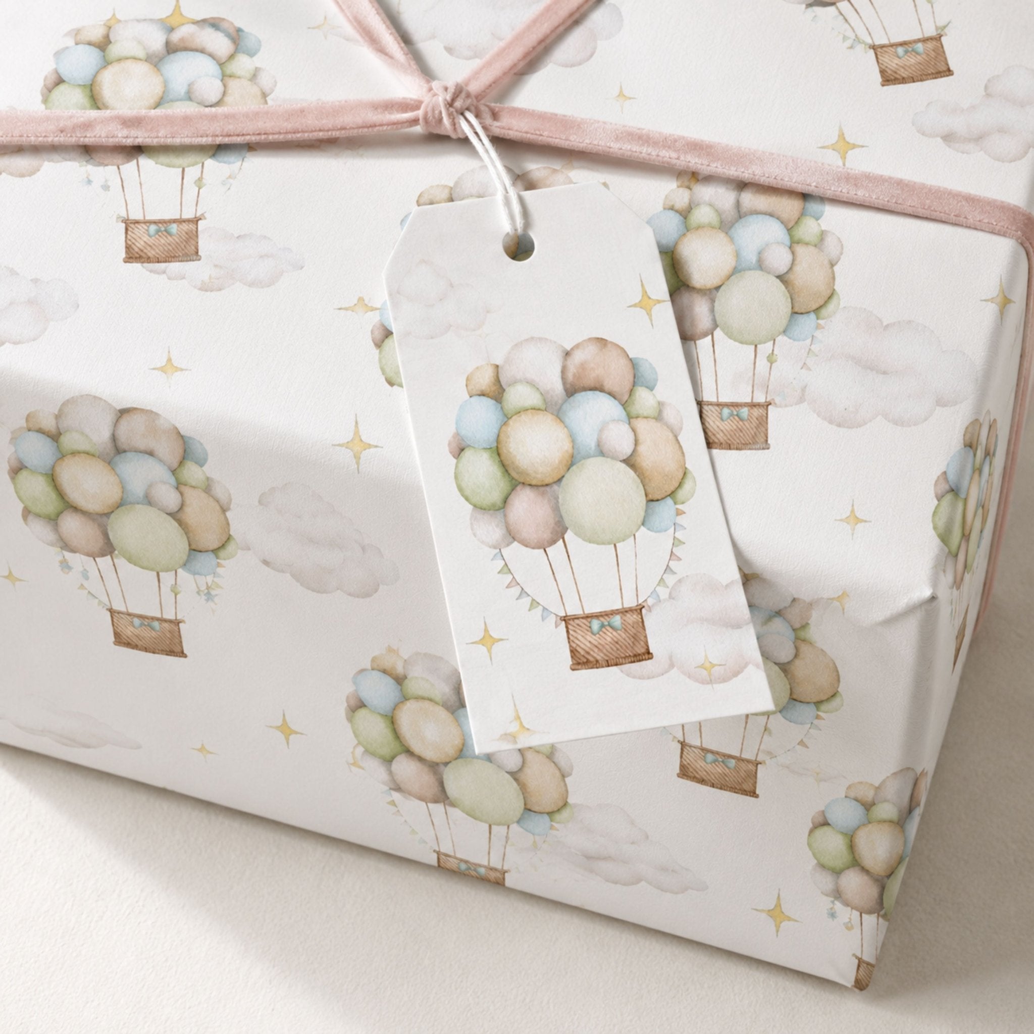 Gift wrapped in Pastel Hot Air Balloon wrapping paper with soft pink ribbon
