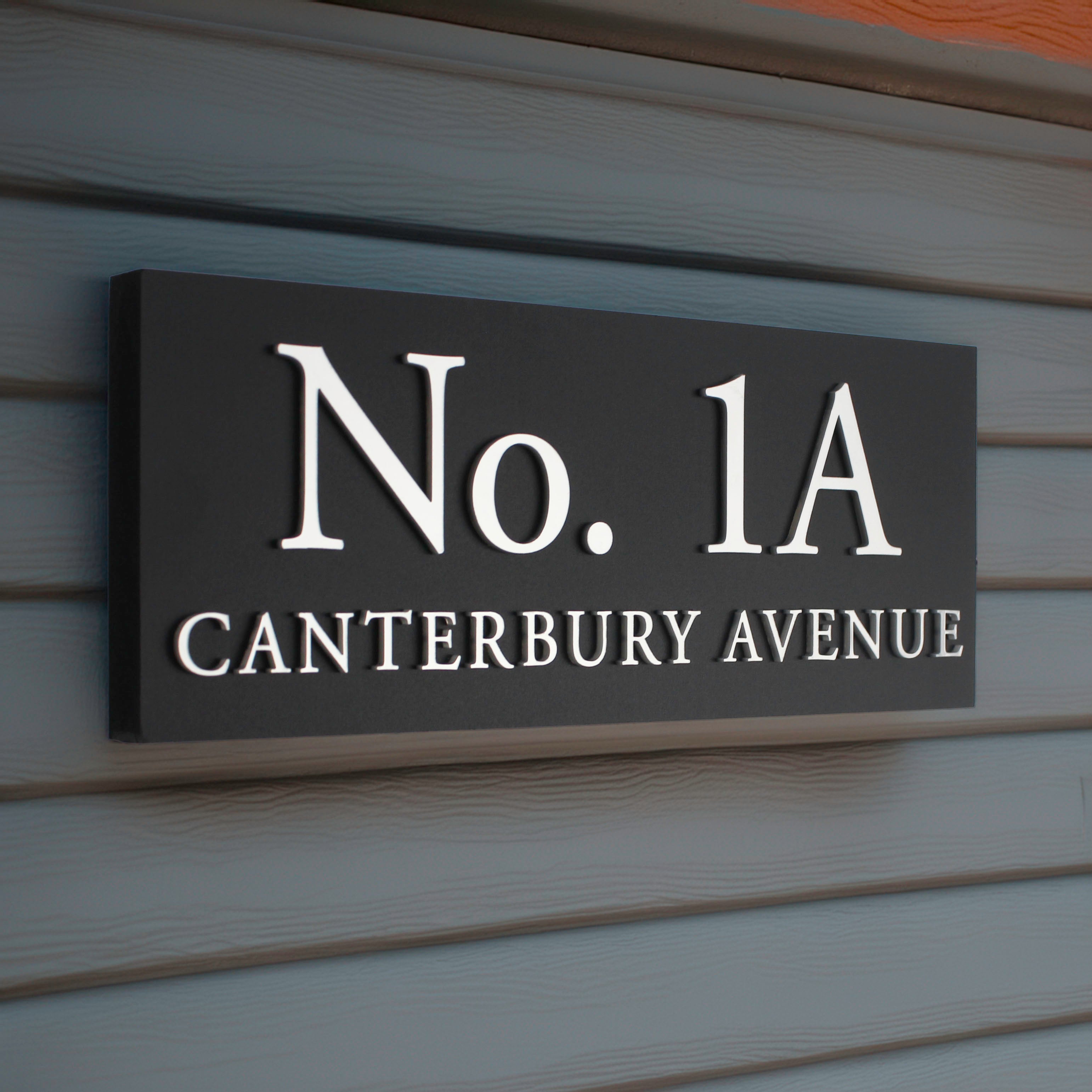 bestselling house sign size 30 x 12cm shown with silver raised design