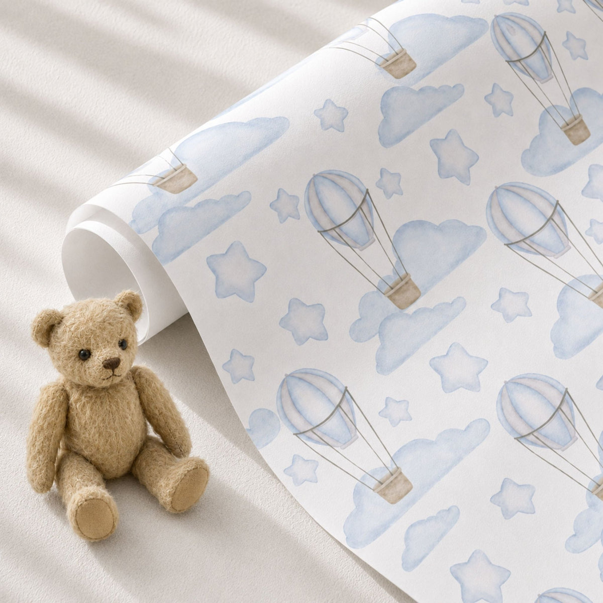 Blue Hot Air Balloon baby gift wrap styled with teddy bear