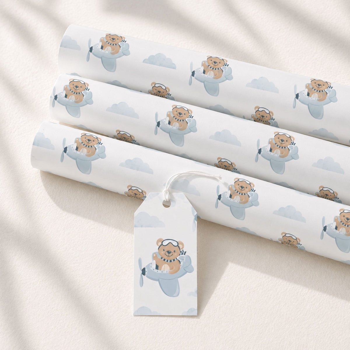 Rolls of Teddy Bear Aeroplane wrapping paper with matching gift tag
