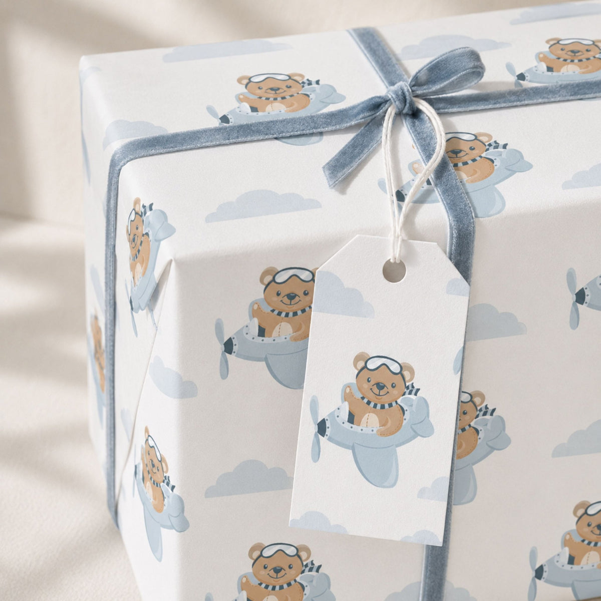 Teddy Bear Aeroplane wrapping paper with matching gift tag and blue ribbon