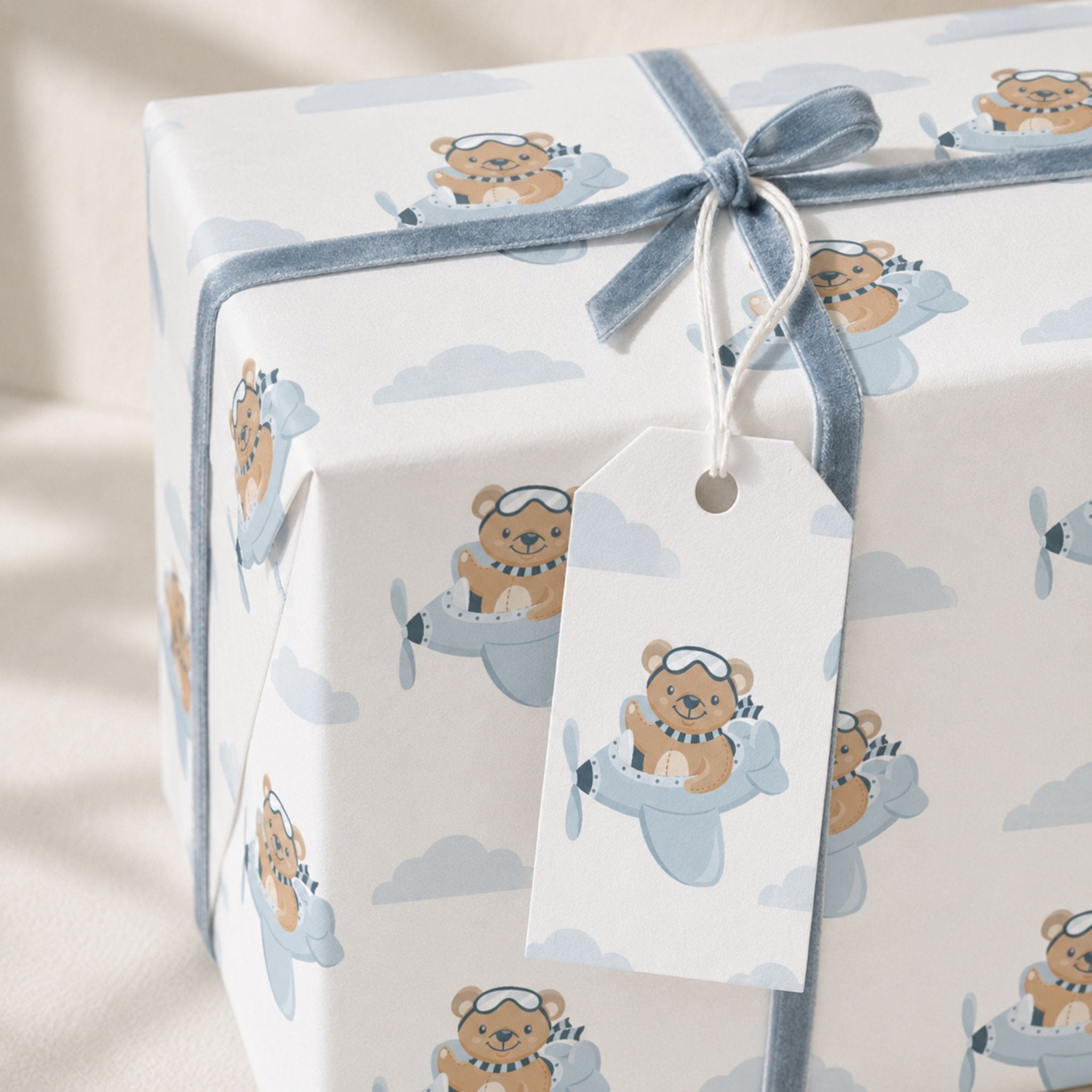 Teddy Bear Aeroplane wrapping paper with matching gift tag and blue ribbon