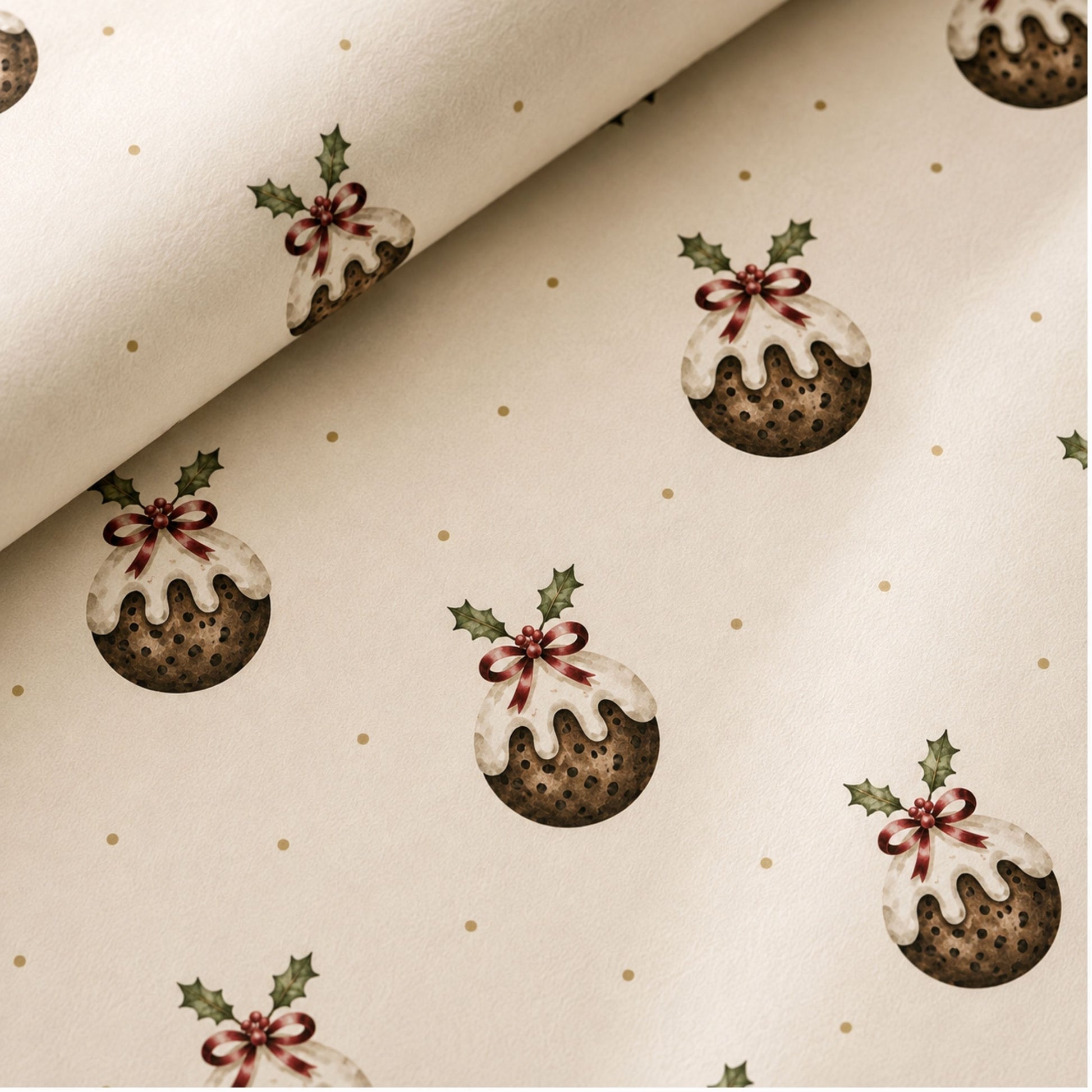 close up of Christmas pudding wrapping paper featuring hand-painted festive puddings with holly details