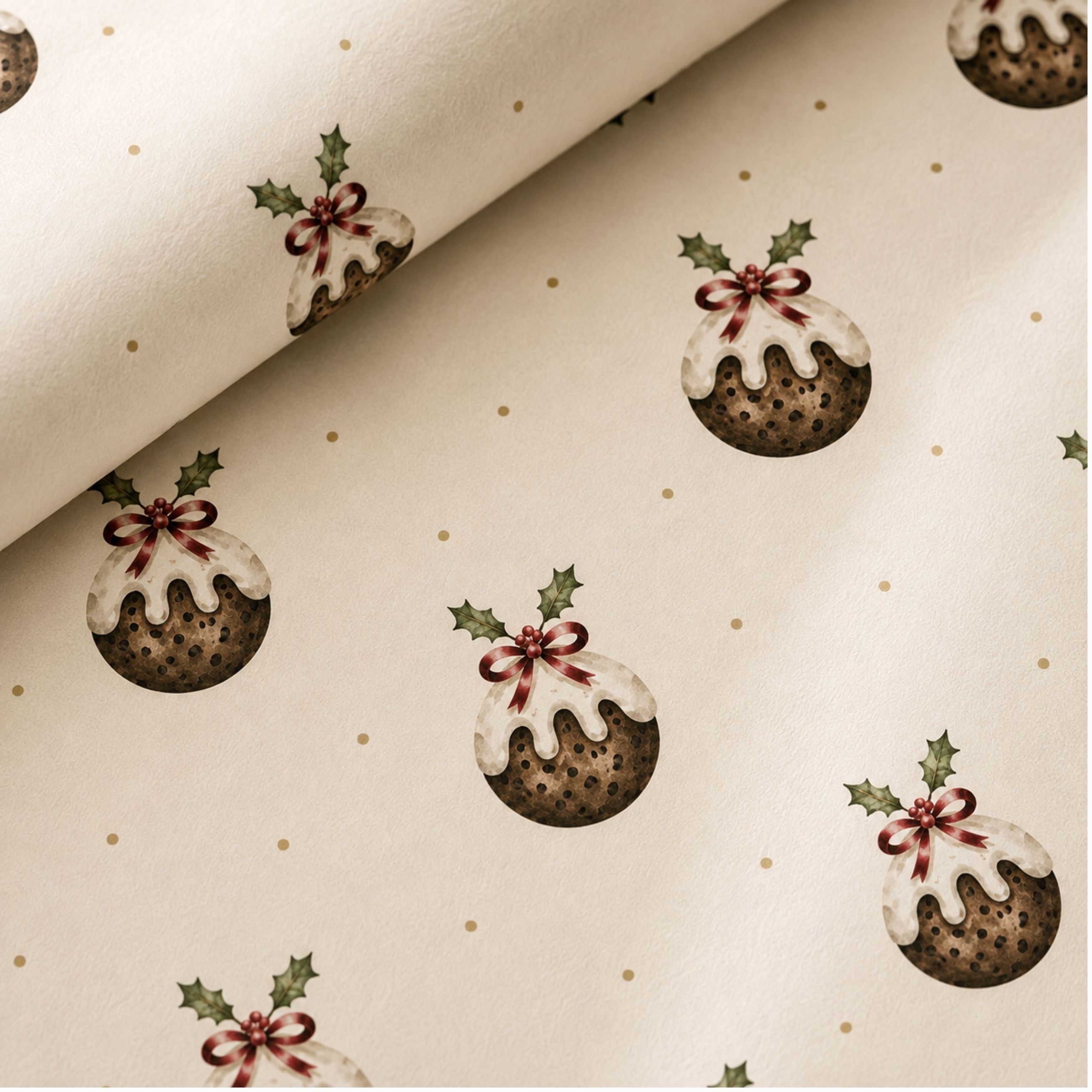close up of Christmas pudding wrapping paper featuring hand-painted festive puddings with holly details