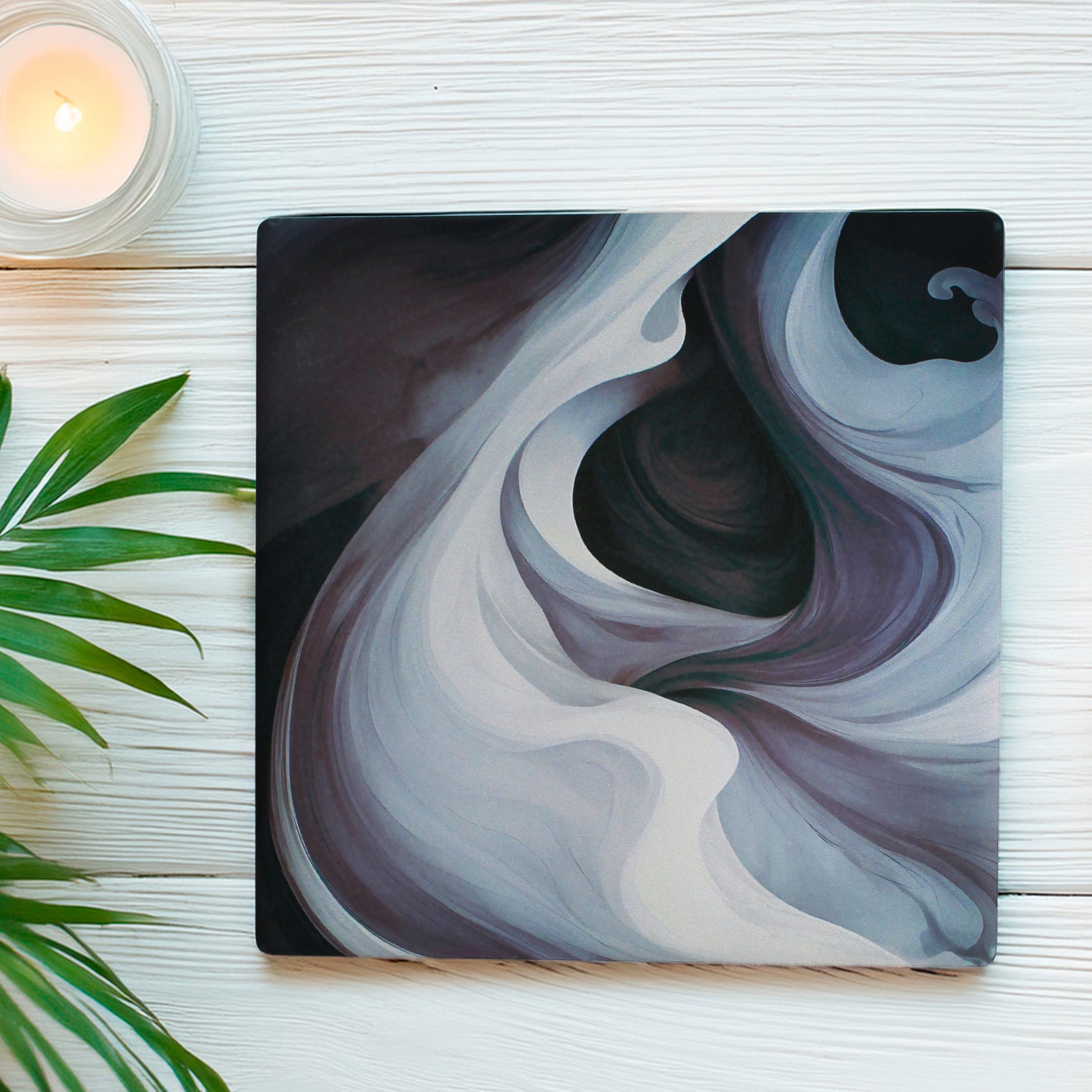 This set of four features two mesmerising swirl variations, blending deep purples, inky blacks, and smoky tones for a bold and mysterious look, With two of each design, this set is perfectly balanced to add intrigue and style to any table. 

Available in matte or gloss finish, so you can choose the perfect look to match your aesthetic.

Each coaster is finished with a crisp white, cork-backed base for both style and practicality.

