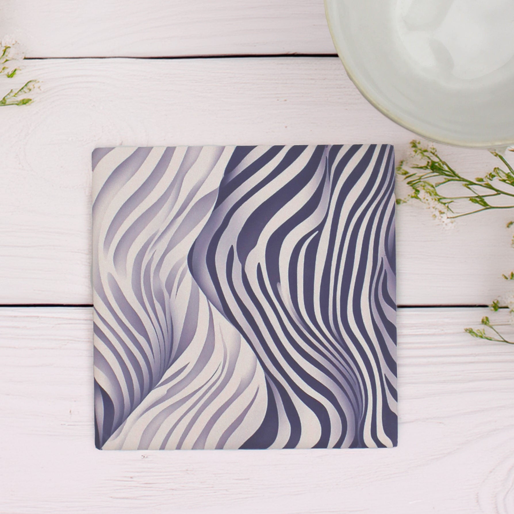 Add a bold touch to any space with our Funky Zebra Pattern Ceramic Coaster Set, featuring a striking zebra-inspired design with a modern twist, this set of 4 brings personality and style to your table.

This elegant coaster set features two distinct yet beautifully coordinated designs, perfect for adding style and sophistication to your table setting.

Available in matte or gloss finish to suit your style.

Each coaster is finished with a crisp white, cork-backed base for both beauty and practicality.