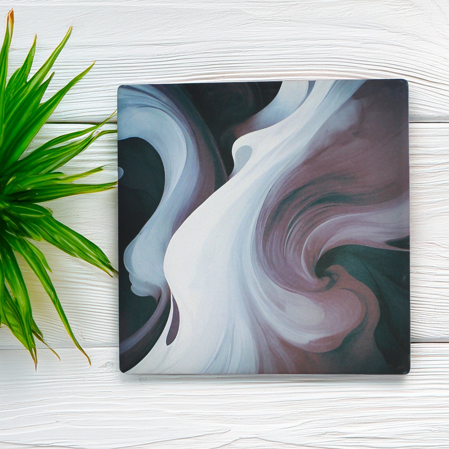 This set of four features two mesmerising swirl variations, blending deep purples, inky blacks, and smoky tones for a bold and mysterious look, With two of each design, this set is perfectly balanced to add intrigue and style to any table. 

Available in matte or gloss finish, so you can choose the perfect look to match your aesthetic.

Each coaster is finished with a crisp white, cork-backed base for both style and practicality.

