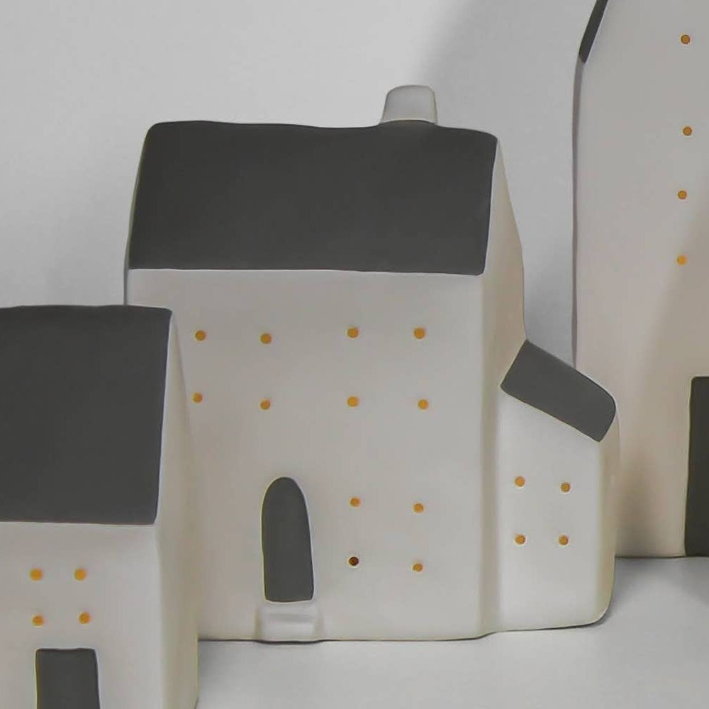  small house models on a white background