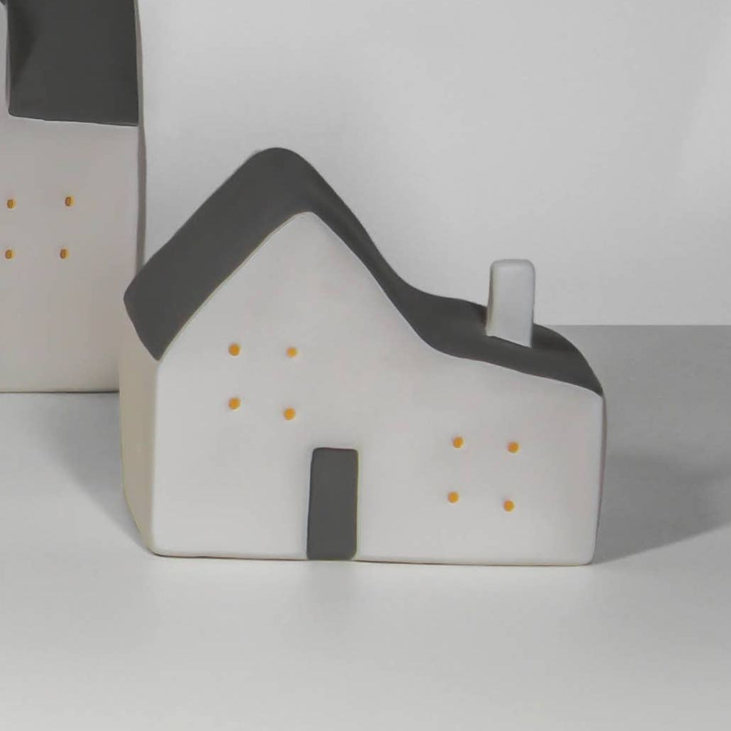 Set of small house models on a white background