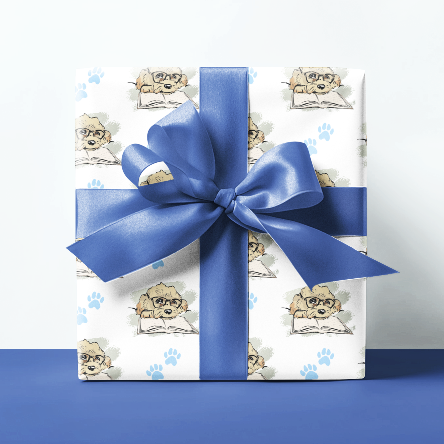 cavapoo image on a gift wrapping paper with blue paw prints