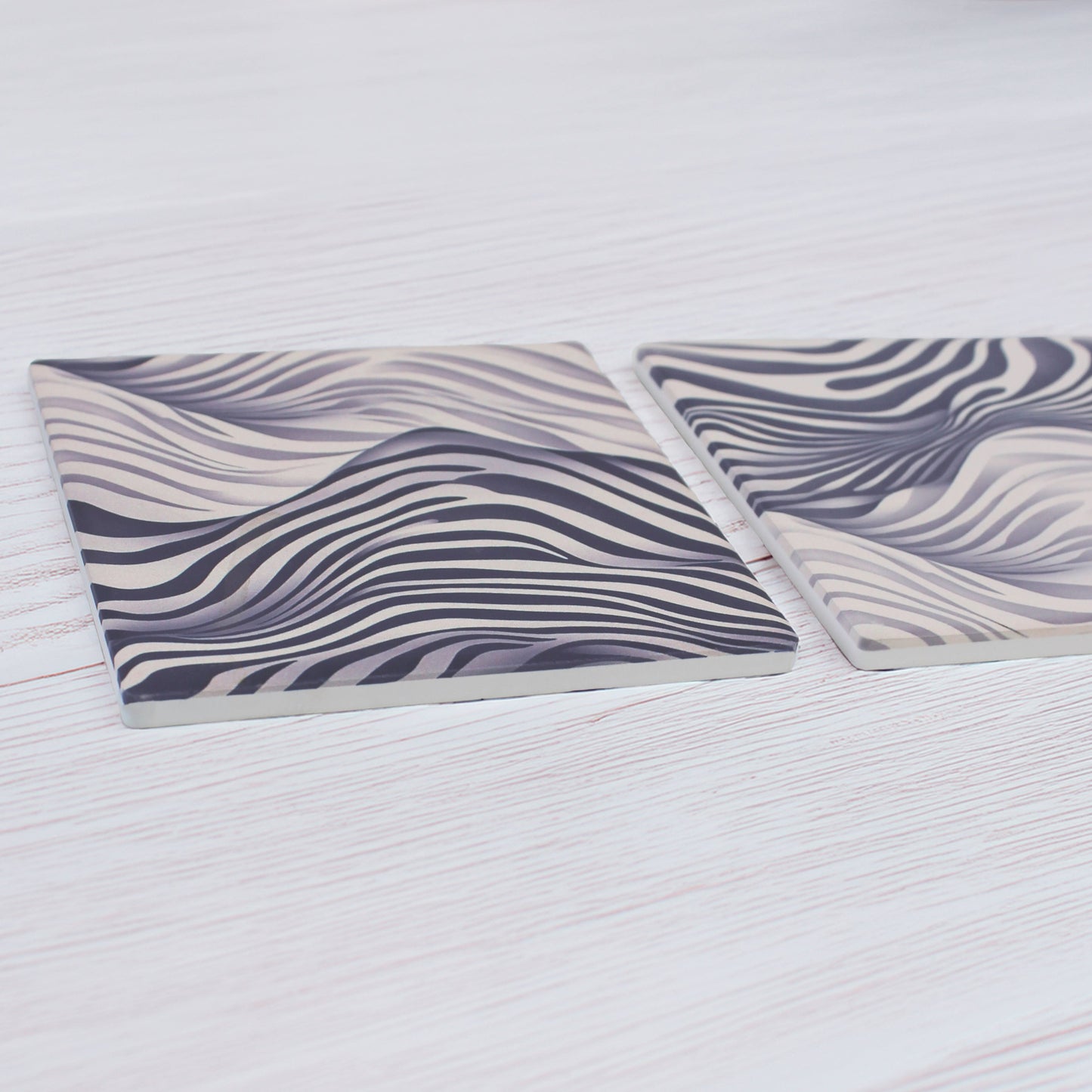 Add a bold touch to any space with our Funky Zebra Pattern Ceramic Coaster Set, featuring a striking zebra-inspired design with a modern twist, this set of 4 brings personality and style to your table.

This elegant coaster set features two distinct yet beautifully coordinated designs, perfect for adding style and sophistication to your table setting.

Available in matte or gloss finish to suit your style.

Each coaster is finished with a crisp white, cork-backed base for both beauty and practicality.