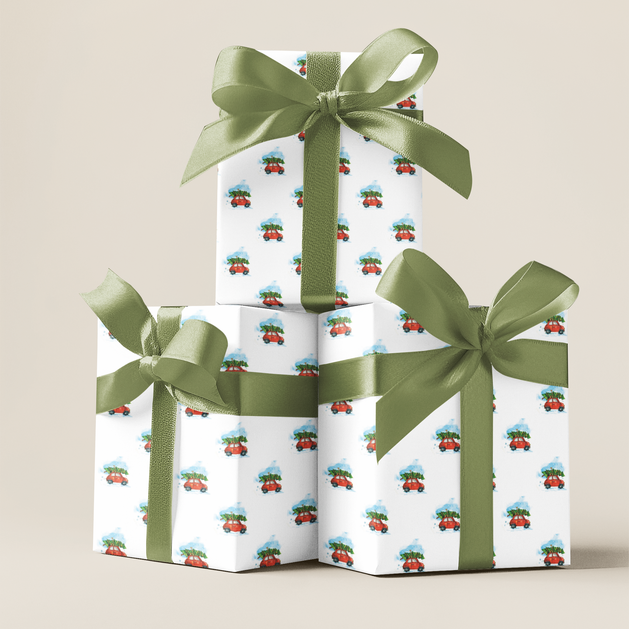 Three stacked gift boxes with green ribbons  and a Christmas car gift wrapping paper