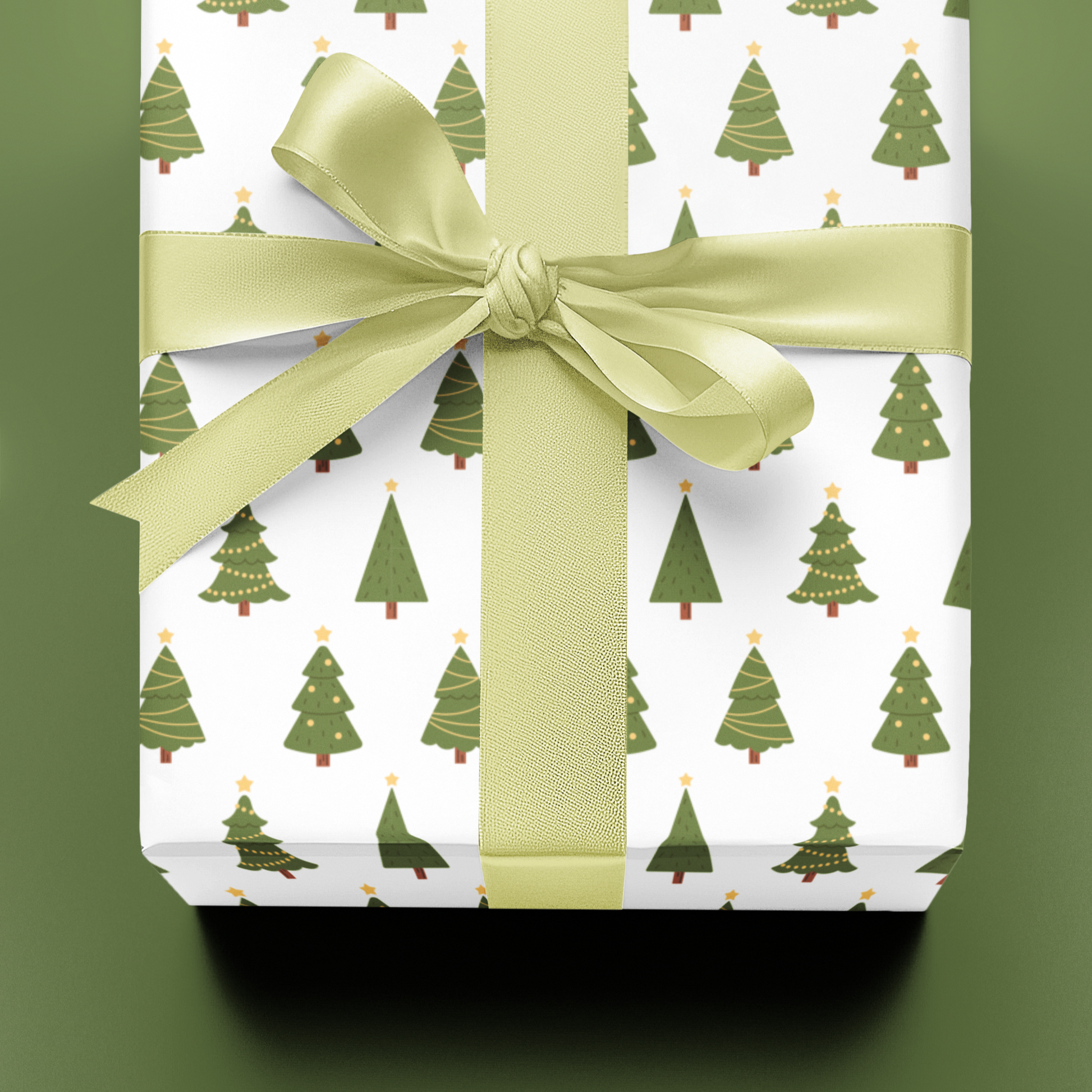 Gift wrapped in paper with green tree pattern and tied with a green ribbon on a green background