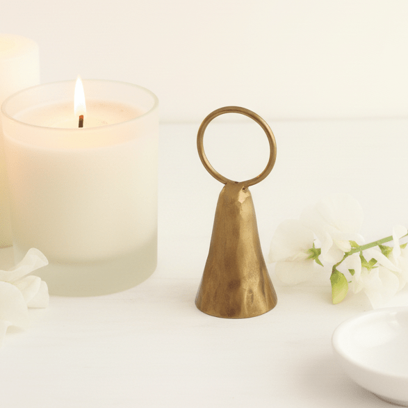 Brass snuffer overhead flat lay ceramic dish