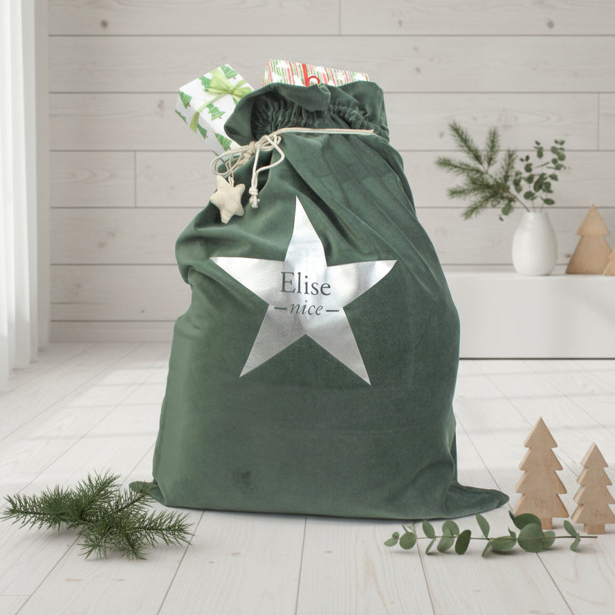 Green drawstring bag with a star-shaped label on a white background