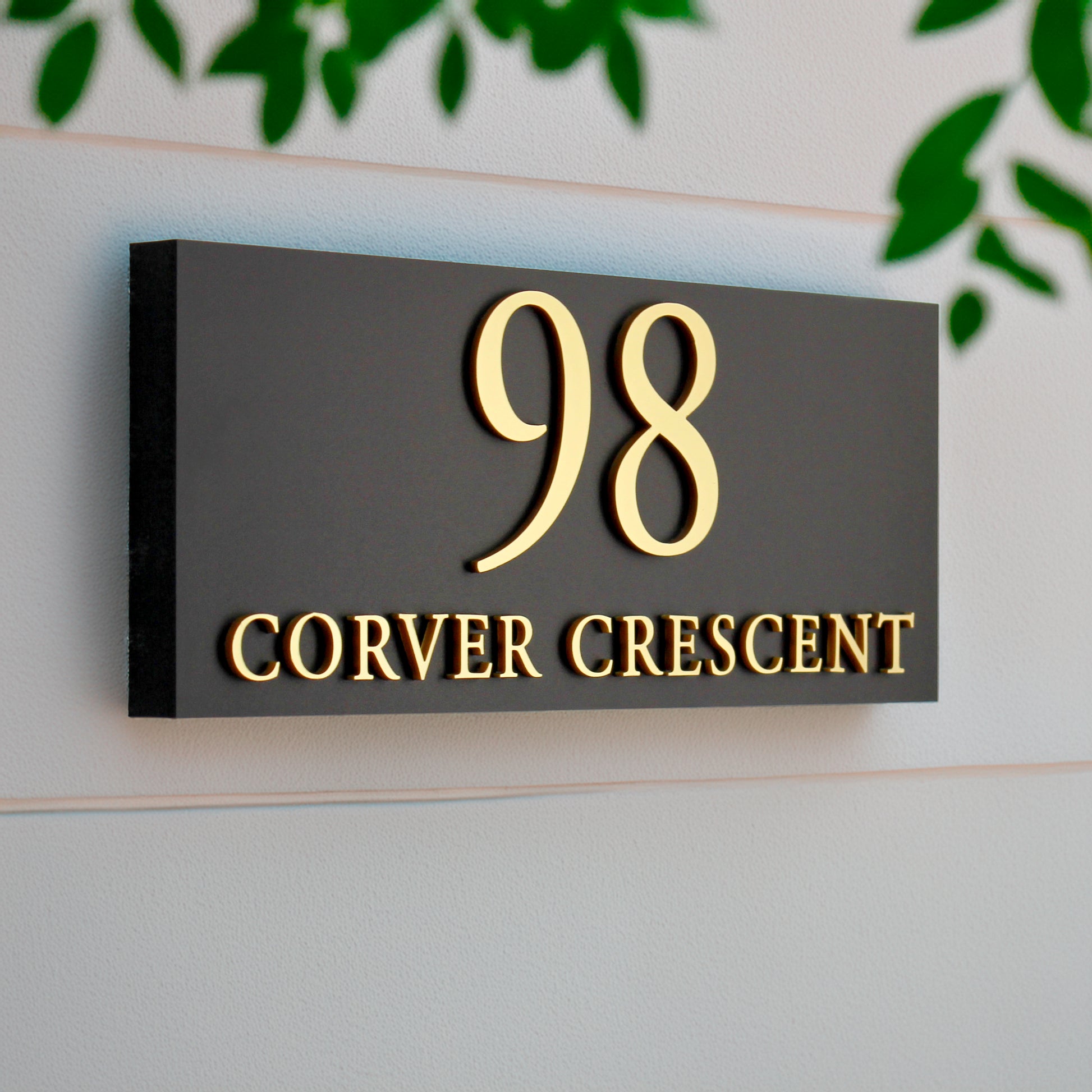 House number sign with raised gold lettering oblong landscape design