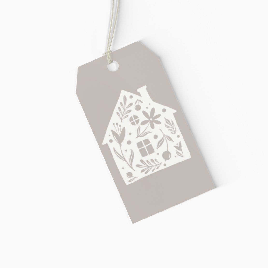Gift tag with decorative house cutout on a white background