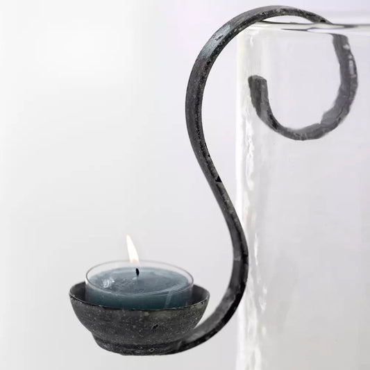 "Close-up of an elegant hanging tea light holder with an antique finish, perfect for creating a cozy atmosphere indoors or outdoors."