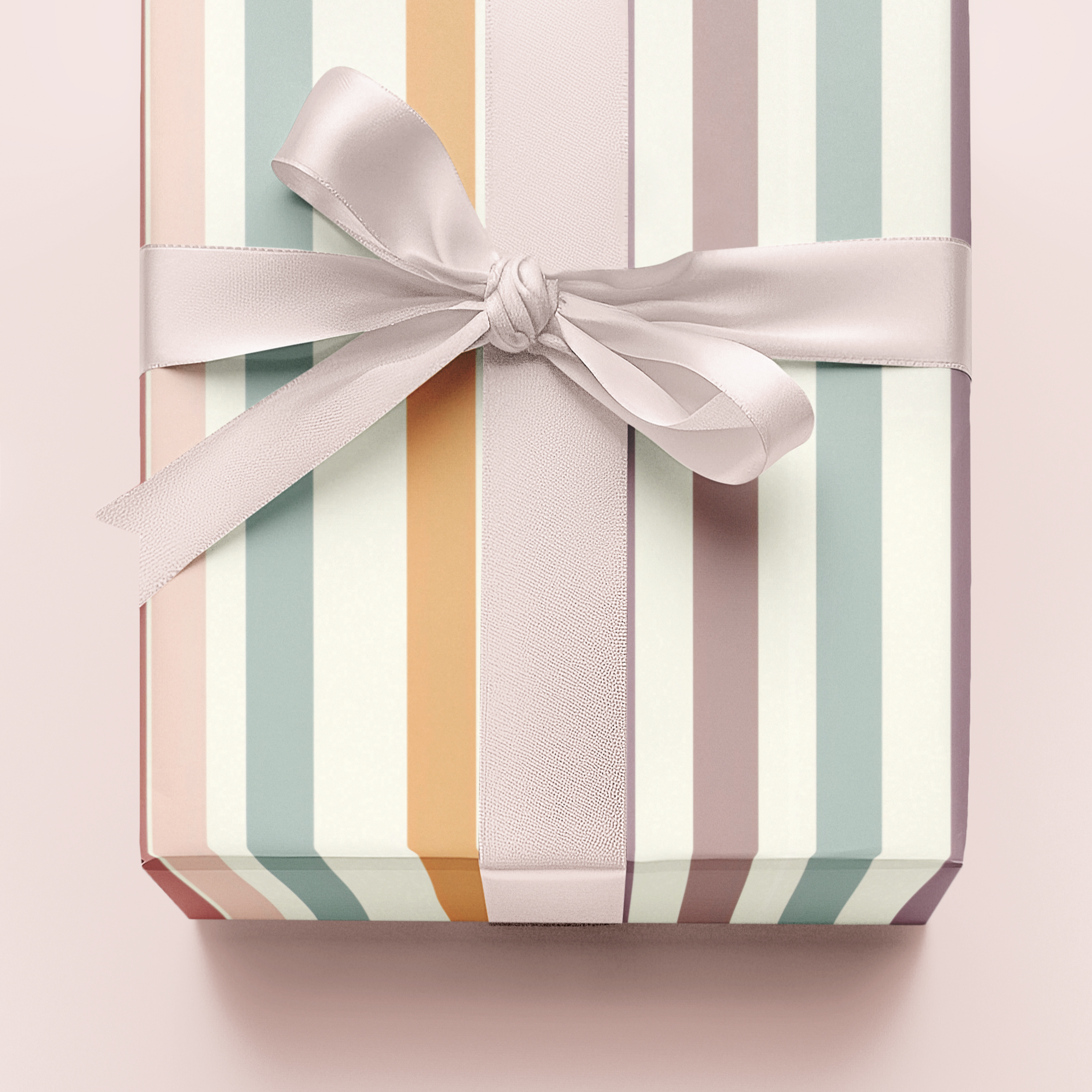 Gift box with striped pattern and ribbon on a light pink background