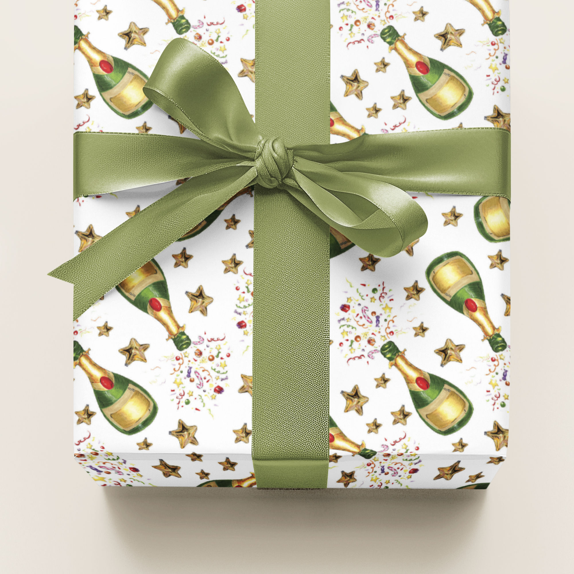 Gift wrap with champagne bottle pattern and green ribbon on a beige background