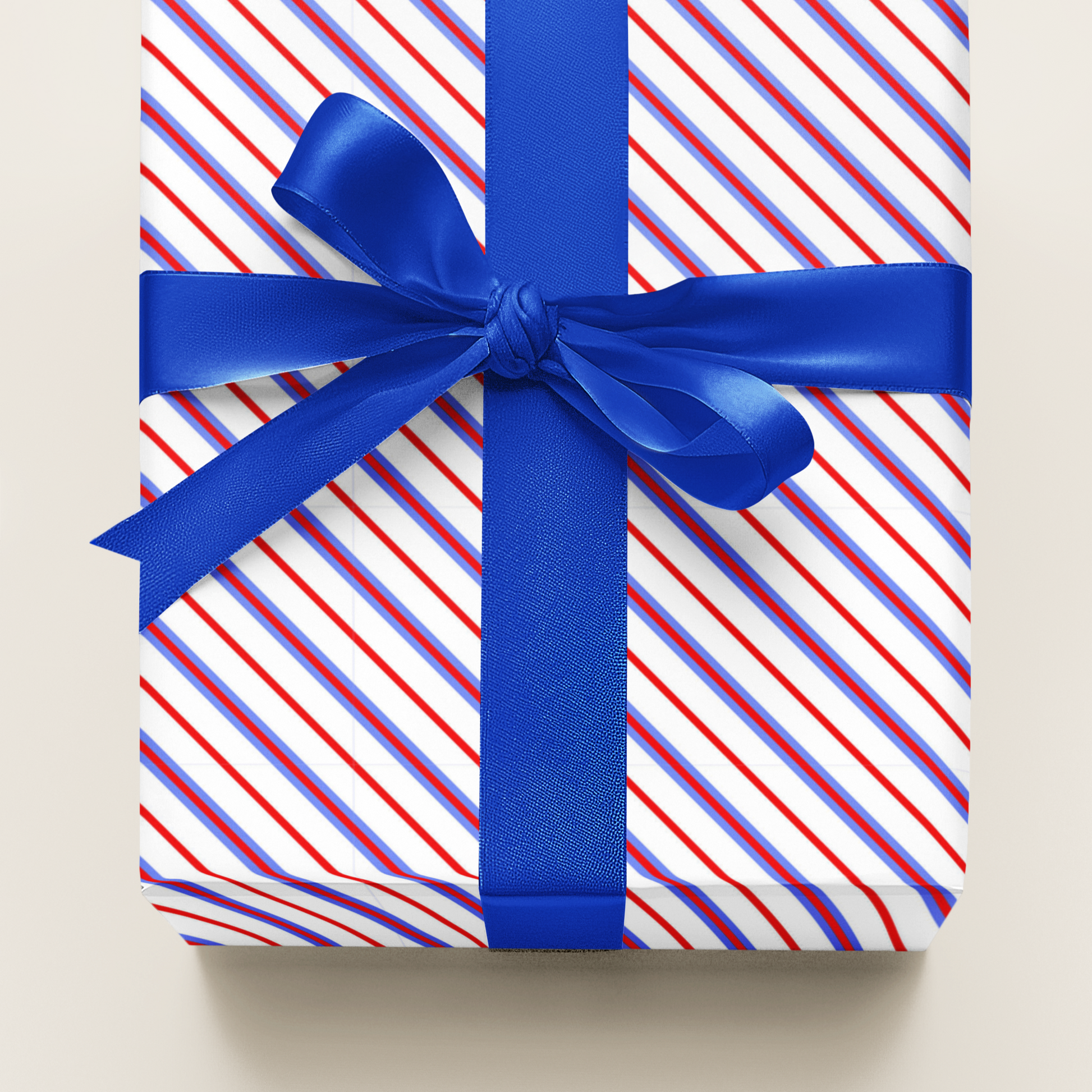 Gift wrap with red and white striped pattern and blue ribbon on a beige background 2 sizes classic pattern
