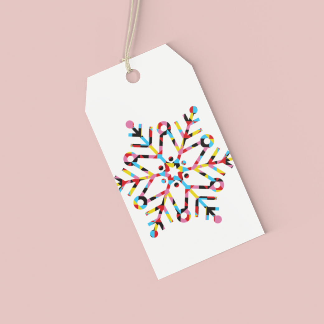 Gift tag with colorful snowflake design on a beige background