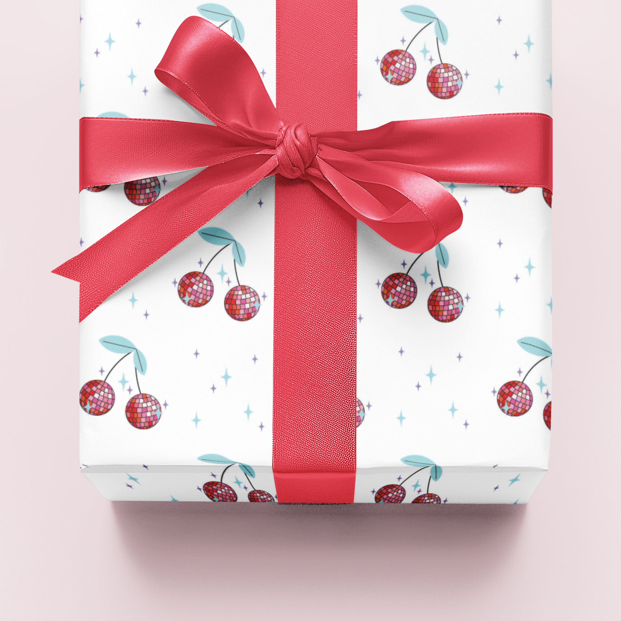 Gift wrapping paper with cherry pattern and red ribbon on a light pink background