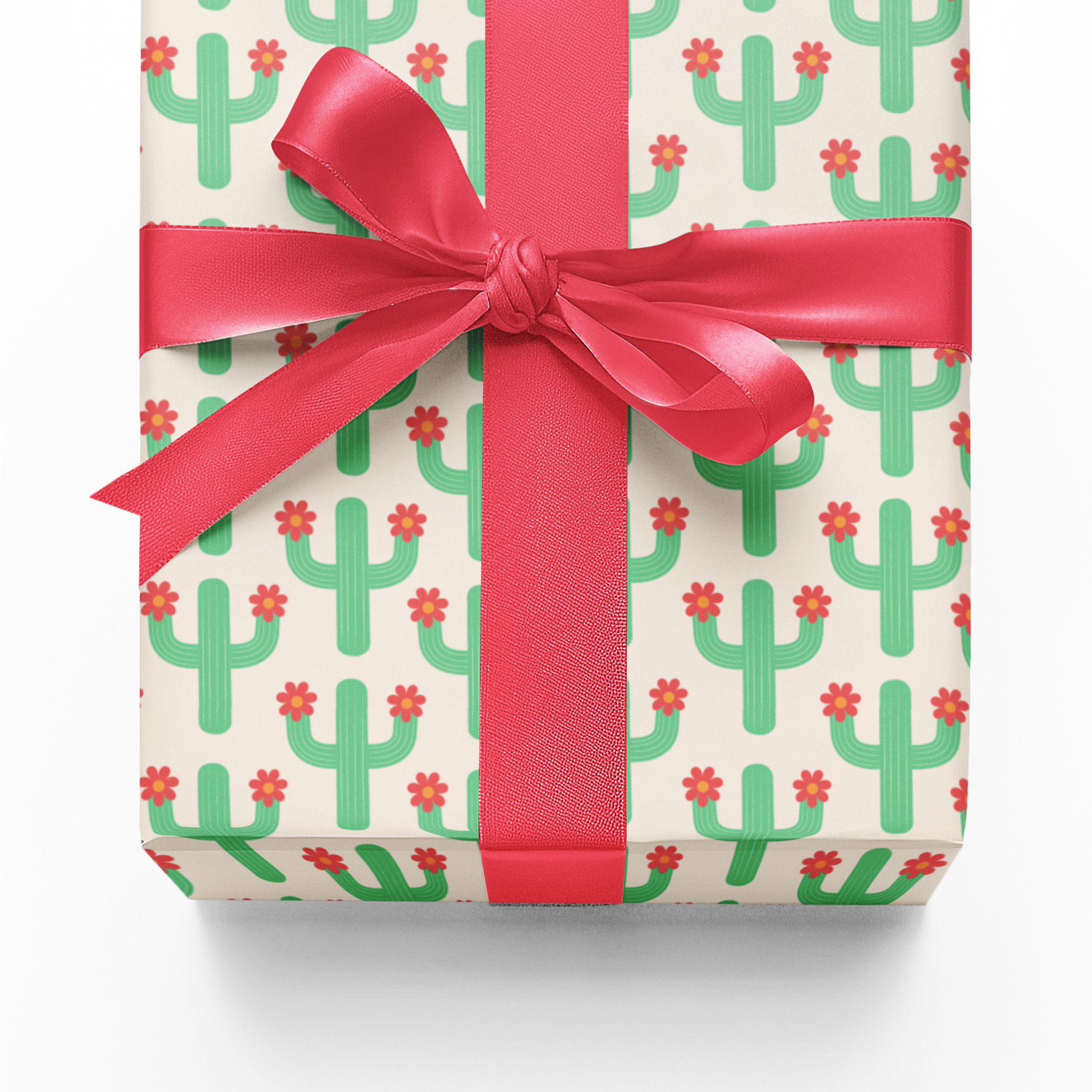 Gift wrap with cactus pattern and pink ribbon on a white background
