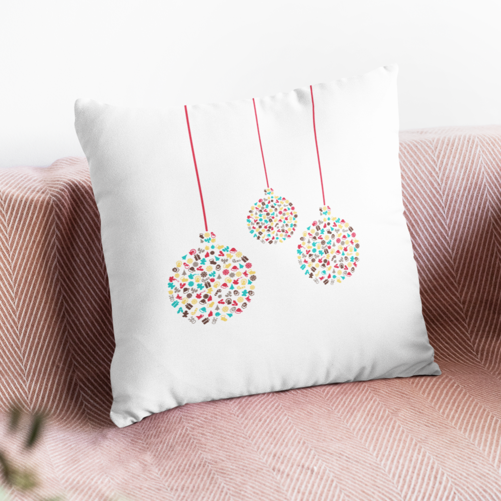 Decorative pillow with festive design on a pink sofa