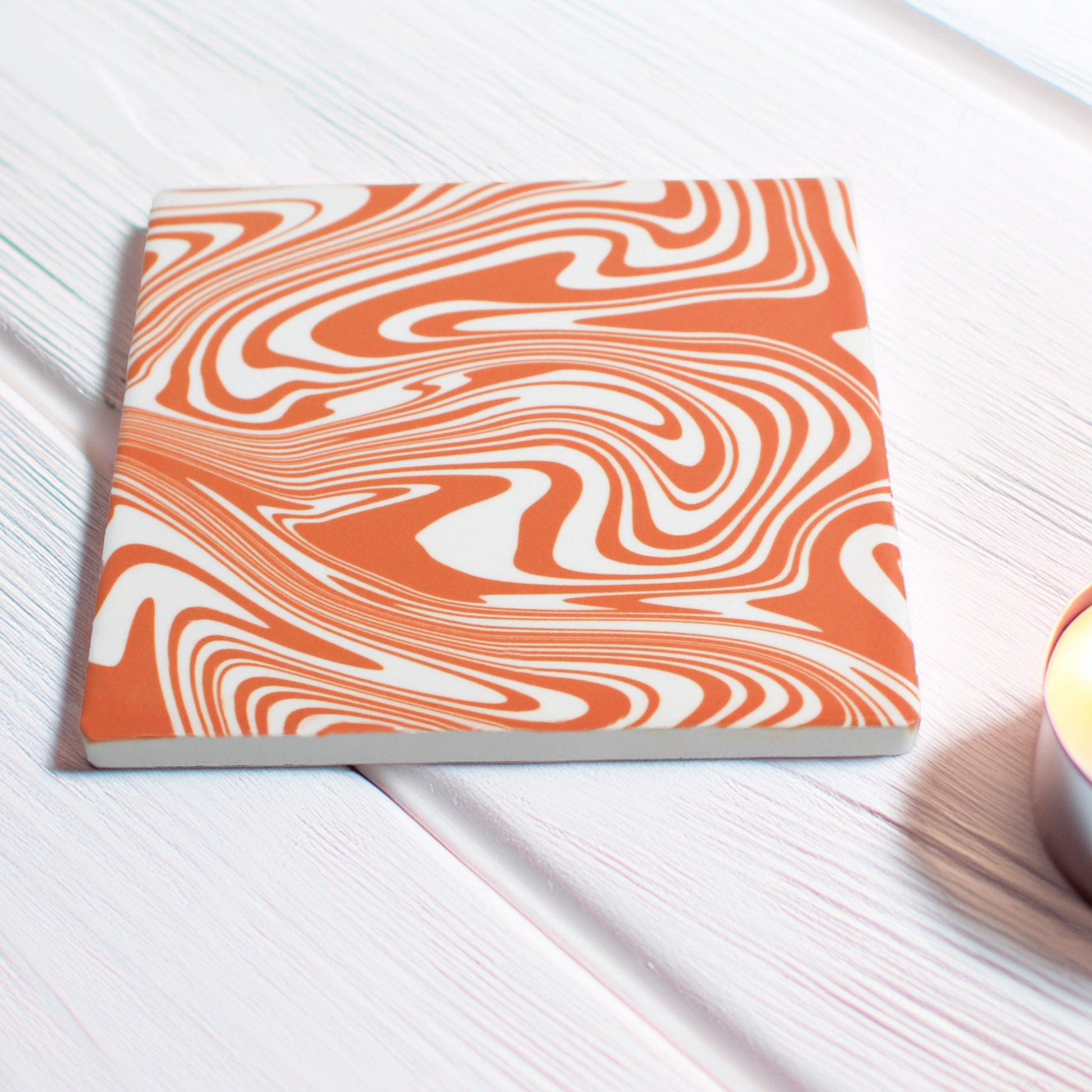 Add a burst of personality to your space with our Funky Swirl Abstract Ceramic Coaster Set. Featuring vibrant, playful swirling patterns, these coasters are designed to liven up any room.

Choose from blue, orange, sage green, or yellow. Want a unique combination? You can mix and match up to four colours, just specify your choices and how many of each!

Available in matte or gloss finish to match your style.

The picture shown is a vibrant orange modern coaster