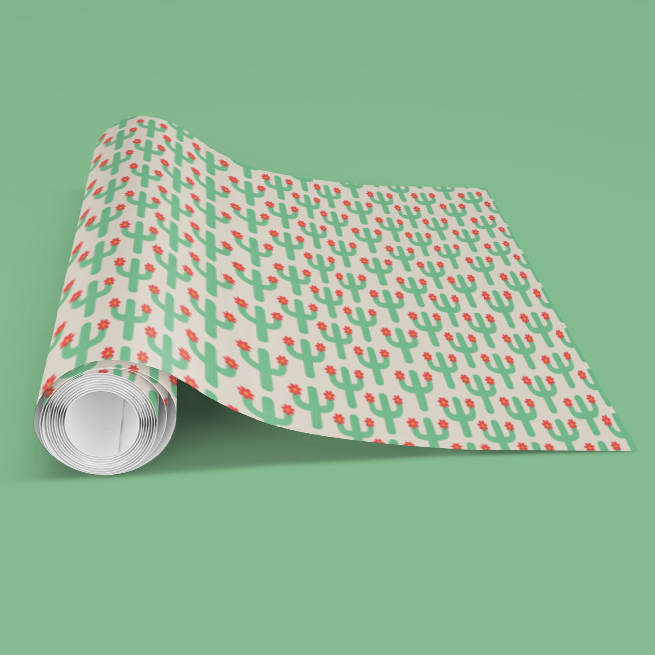 Roll of patterned paper with red and green cactus design on a green background perfect for teens birthdays