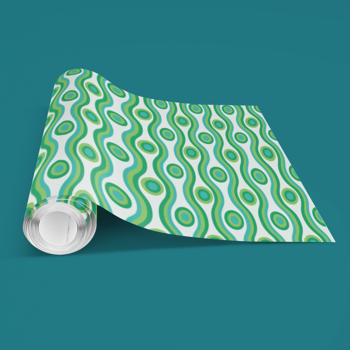Roll of green and white patterned paper with a clear plastic cover on a teal background